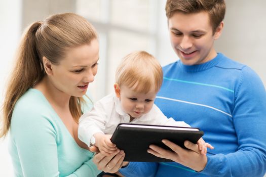 happy parents and adorable baby with tablet pc