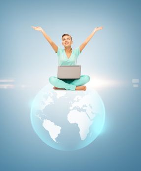news, technology and environment concept - woman with laptop and sphere globe