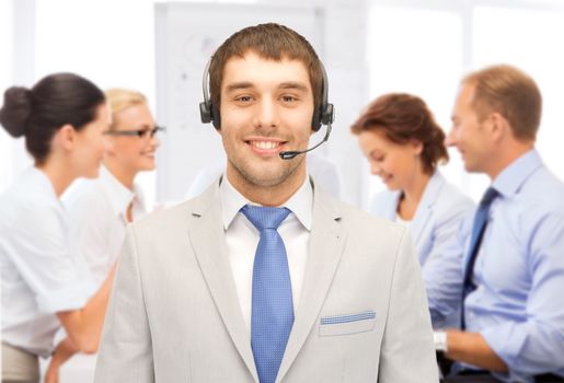 business and call center concept - helpline operator with headphones in call centre
