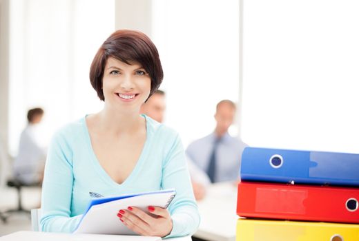 business and education concept - woman with folders