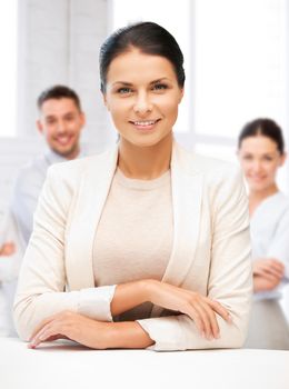 business concept - attractive young businesswoman in office