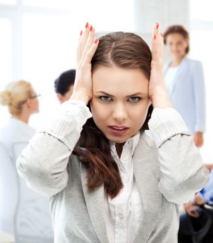 business concept - stressed businesswoman on meeting in office