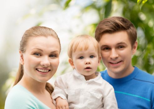 family, parenting and child care concept - happy family with adorable child