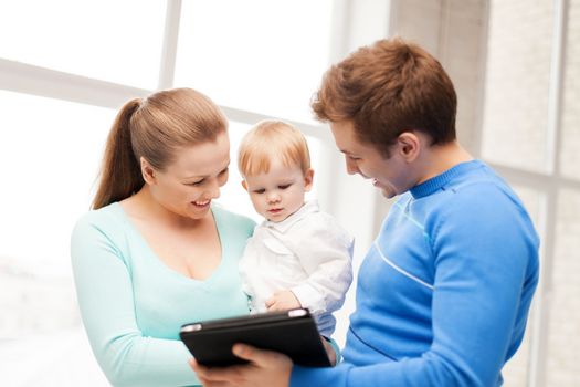 happy parents and adorable baby with tablet pc