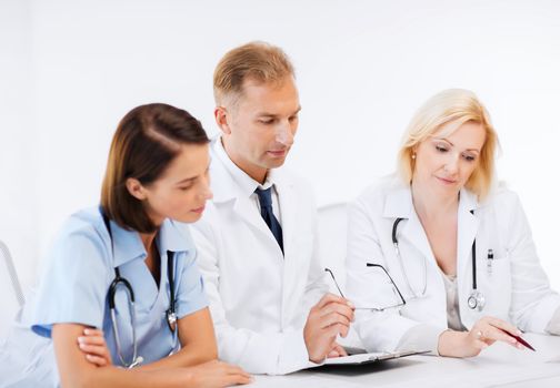 healthcare and medical concept - team or group of doctors on meeting