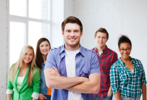 education concept - student boy with group of students at school