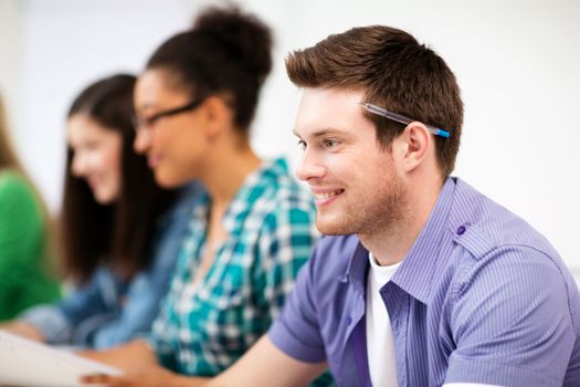 education concept - student with computer studying at school