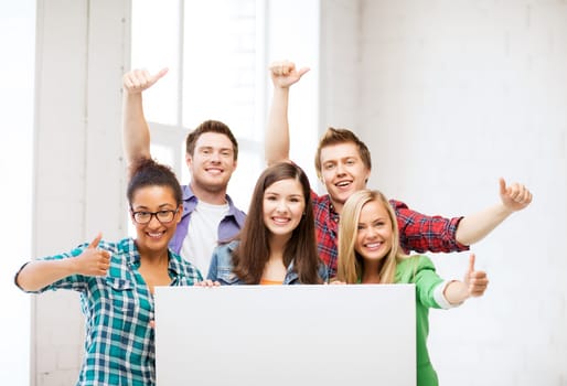 education concept - group of students at school with blank white board