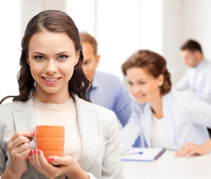 business concept - beautiful businesswoman with cup of coffee