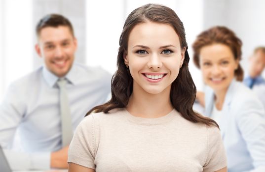 business concept - attractive young businesswoman in office