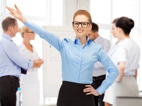 business concept - attractive young businesswoman in office