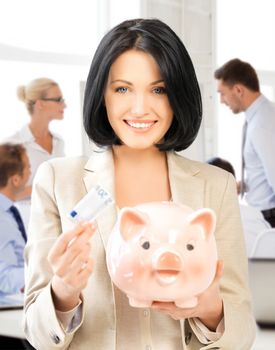 business and money saving concept - woman with piggy bank and cash money