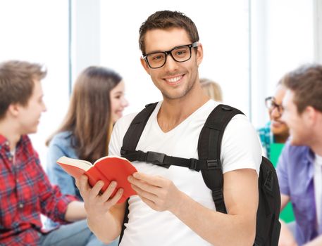 education concept - student boy reading book at school