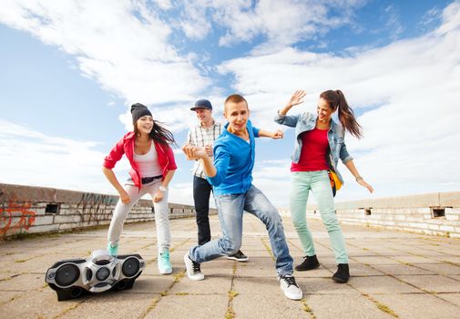 sport, dancing and urban culture concept - group of teenagers dancing