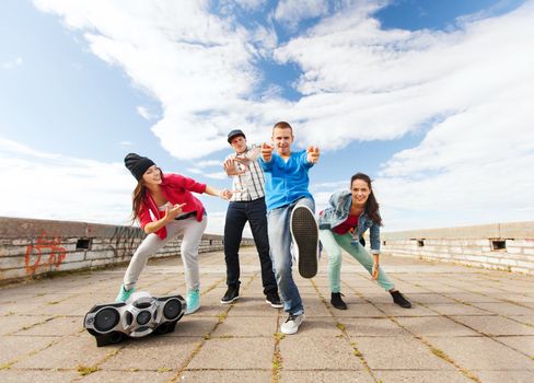 sport, dancing and urban culture concept - group of teenagers dancing