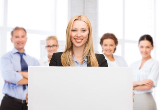 business and advertising concept - smiling businesswoman with white blank board