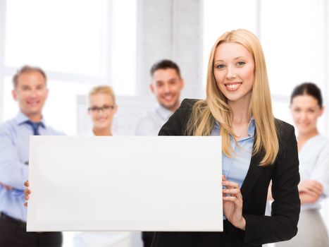 business and advertising concept - smiling businesswoman with white blank board