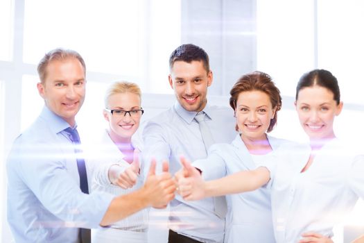 business and office concept - business team showing thumbs up in office