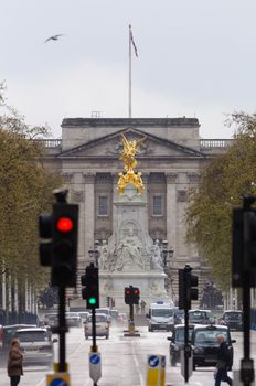 LONDON, UK - CIRCA APRIL 2012: The Queen Victoria Memorial and Buckingham Palace as seen from the Mall by a rainy day.