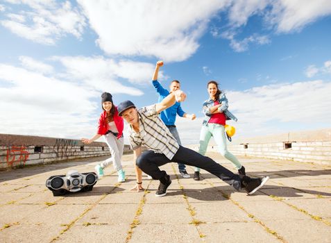 sport, dancing and urban culture concept - group of teenagers dancing