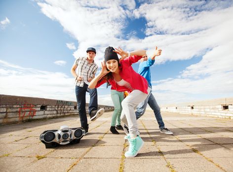 sport, dancing and urban culture concept - group of teenagers dancing