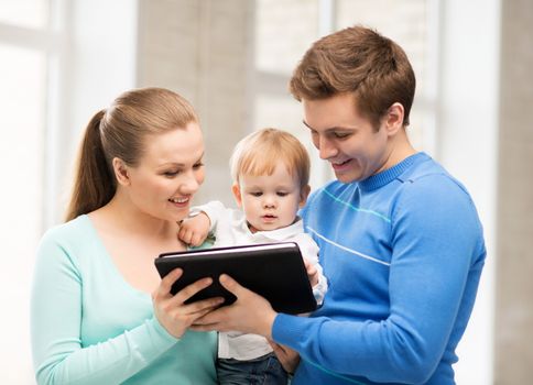 happy parents and adorable baby with tablet pc