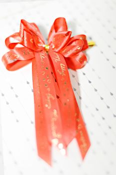 Decoration red glossy ribbon bow on ribbon print word valentine