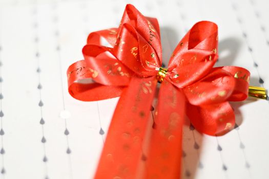 Decoration red glossy ribbon bow on ribbon print word valentine