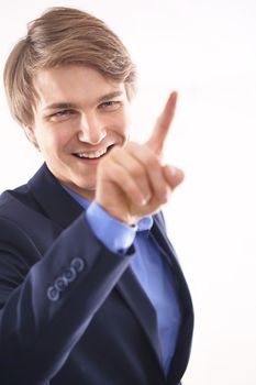 Portrait of a young elegant man in blue suit pointing his finger at the screen