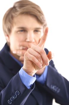 Portrait of a young elegant man in blue suit pointing his finger at the screen