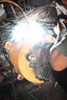 Welder working a welding metal and sparks