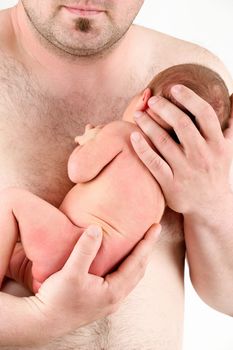 hands of a father holding his newborn baby girl , sleeping newborn baby in father hand - the first week of the new life