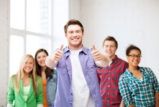 education - student ith group of students at school showing thumbs up