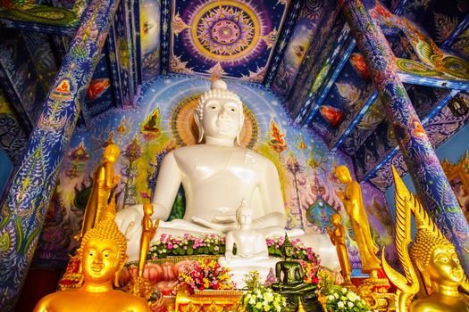 white Buddha image in temple hall,Chiangrai,Thailand