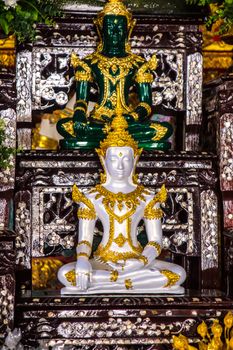 white Buddha image in temple hall,Chiangrai,Thailand