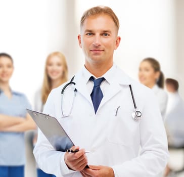 healthcare and medical concept - male doctor with stethoscope and clipboard