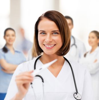 healthcare and medical - female doctor with thermometer and stethoscope