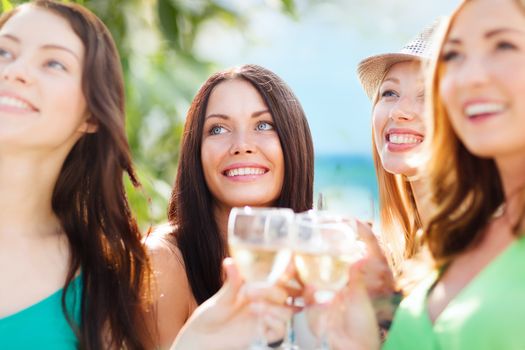 summer holidays, vacation and celebration - girls with champagne glasses