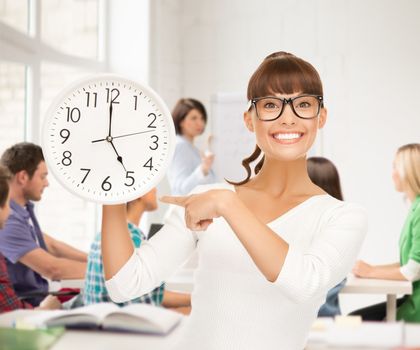 education and time management concept - attractive student showing clock