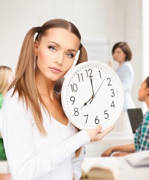 education and time management concept - attractive student showing clock