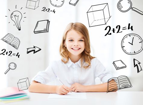 education and school concept - little student girl studying at school