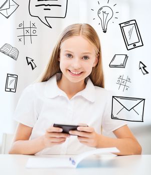 education, school, technology and internet concept - little student girl with smartphone at school