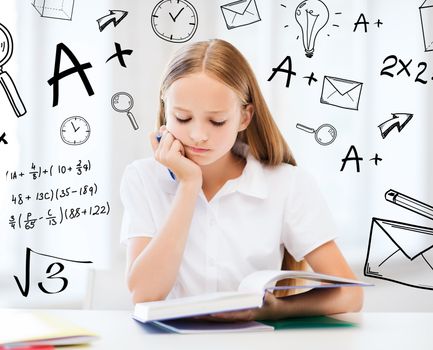 education and school concept - little student girl studying at school