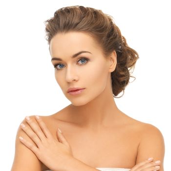 health and beauty concept - face and hands of beautiful woman with updo (can be used as a template for jewelry)