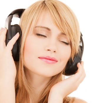 music and entertainment concept - happy girl with headphones