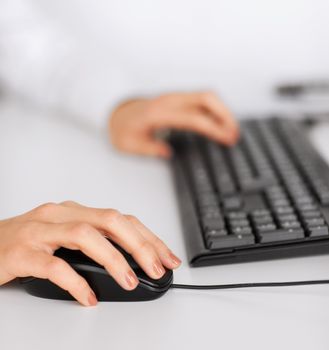 business, office, school and education concept - woman hands with keyboard and mouse
