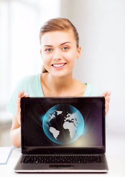 news, technology and environment concept - woman with laptop and sphere globe