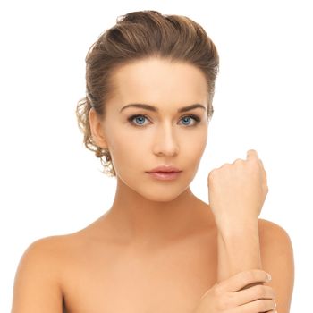 health and beauty concept - face and hands of beautiful woman with updo (can be used as a template for jewelry)