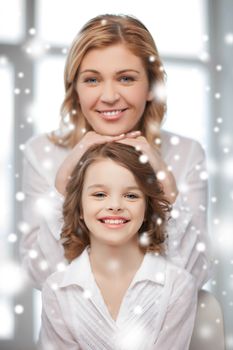 family, children, christmas, x-mas, love concept - happy mother and daughter