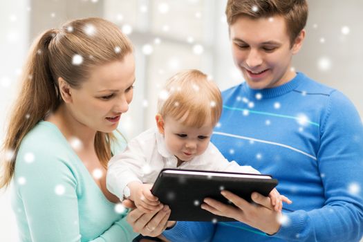 family, children, christmas, x-mas, love, technology concept - happy parents and adorable baby with tablet pc